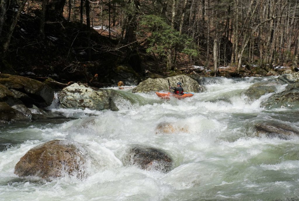 Mike Mainer runs a boulder garden on Patterson Brook Upper White River Vermont Whitewater Kayaking