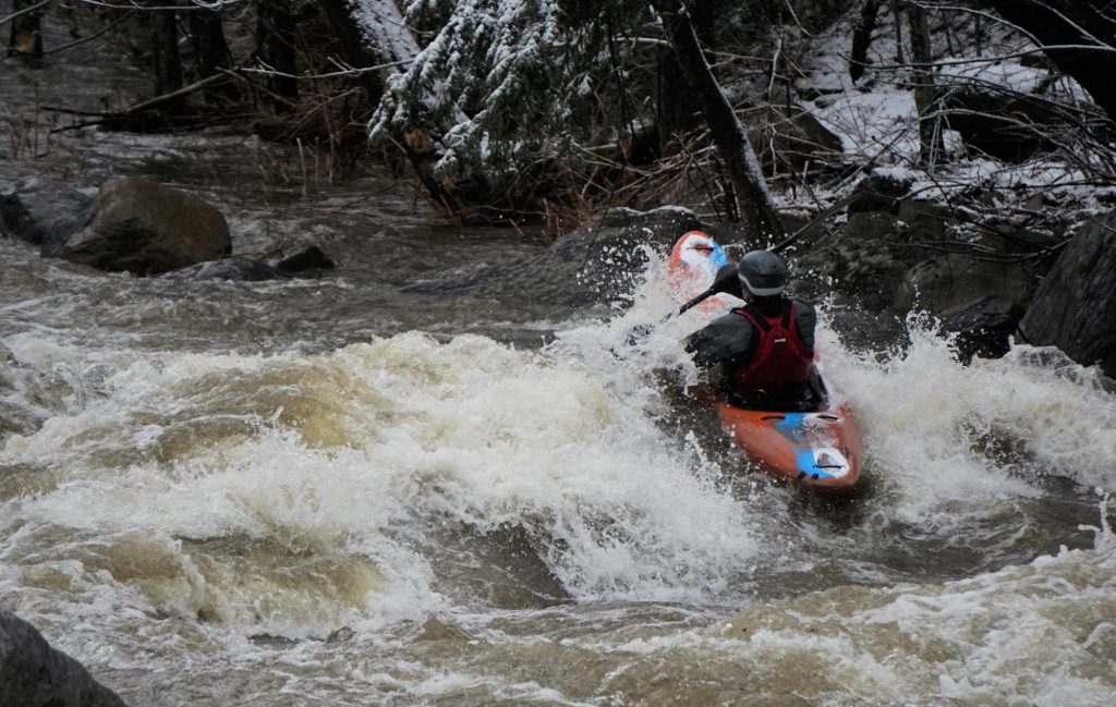 Mike Mainer runs a rapid on the lower New Haven River Bristol Vermont Whitewater Kayaking