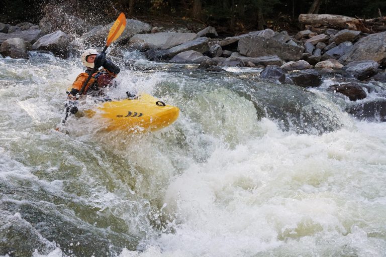 Clay Murphy runs a rapid on the New Haven River Bristol Vermont Whitewater Kayaking