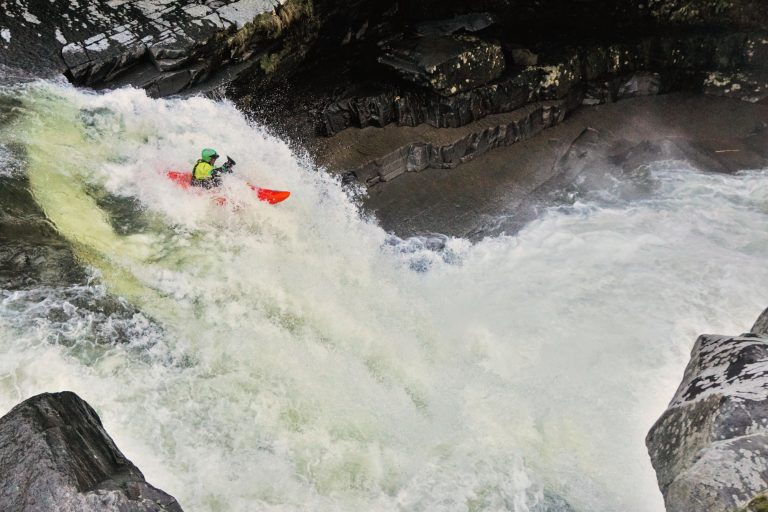 Whitewater Kayaker going over Bartletts Falls New Haven River Vermont