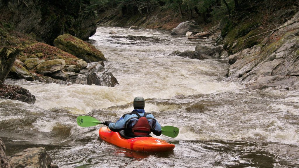 Simone Orlandi runs a rapid on the Trout River Vermont Whitewater Kayaking