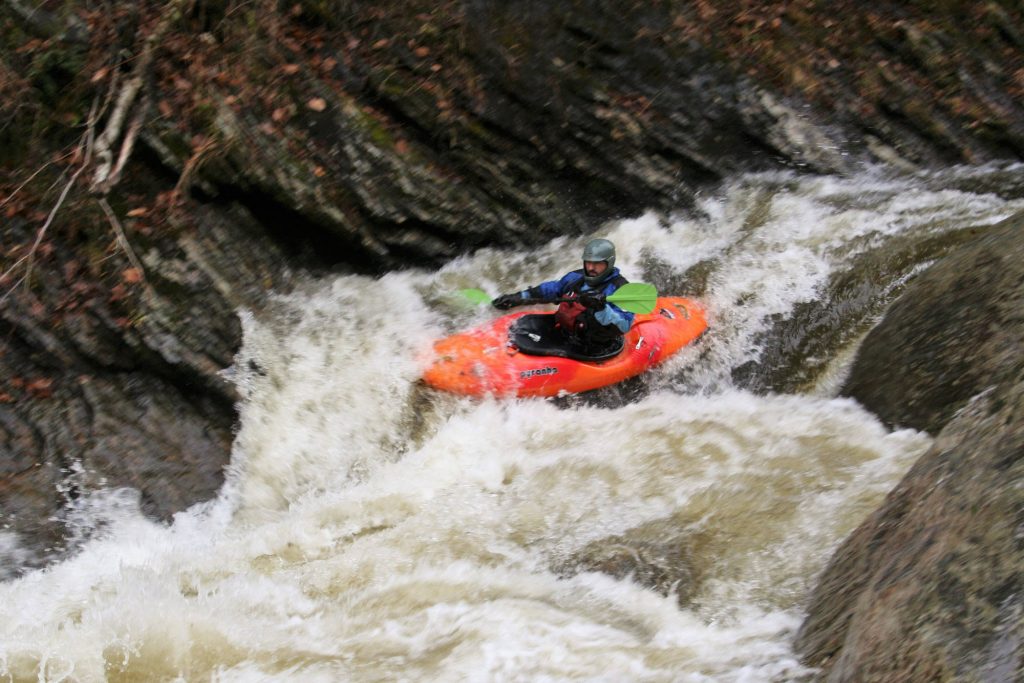 Simone Orlandi runs a rapid on the Trout River Vermont Whitewater Kayaking