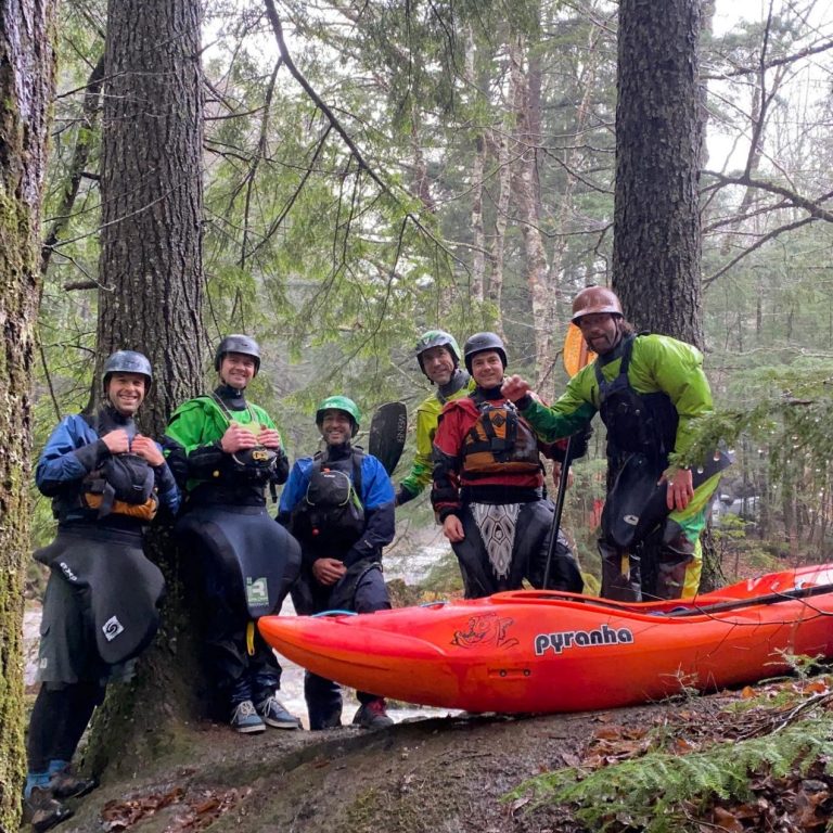 A group of Vermont whitewater kayakers excited to get on the river