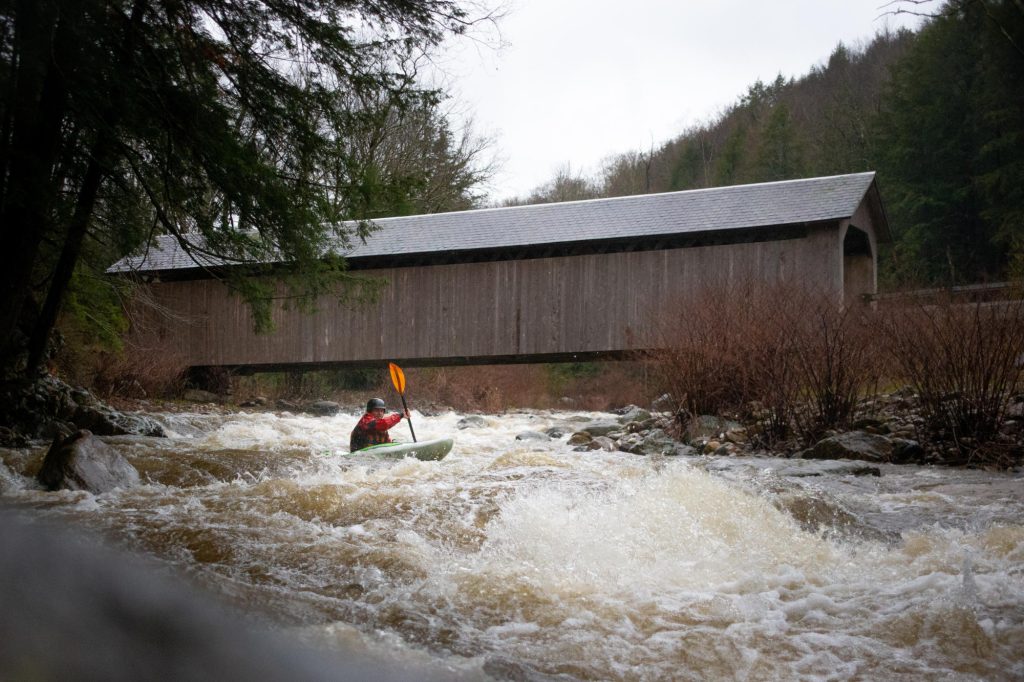 Scott Gilbert runs the rapids below the Brown Covered Bridge on The Cold River, Vermont Whitewater Kayaking