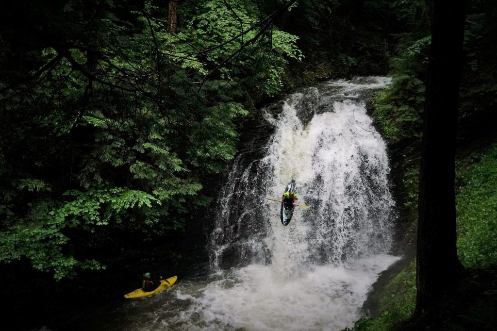 Justin Beckwith runs Lincoln Brook Falls as Culley Thomas looks on from below Vermont Whitewater Kayaking