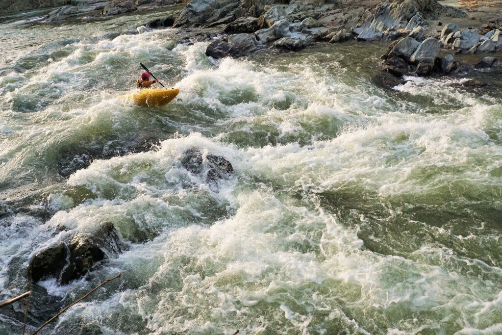 Clay Murphy kayaking the lower Mad River Vermont whitewater kayaking