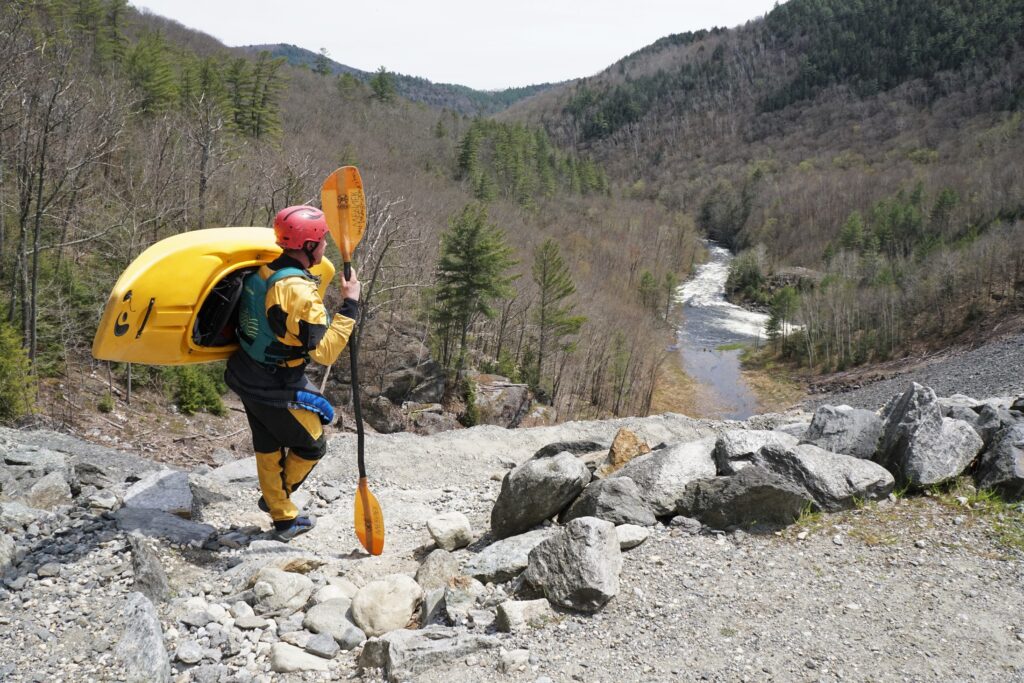 Clay Murphy stands overlooking the path down the dam on the West River Vermont whitewater kayaking