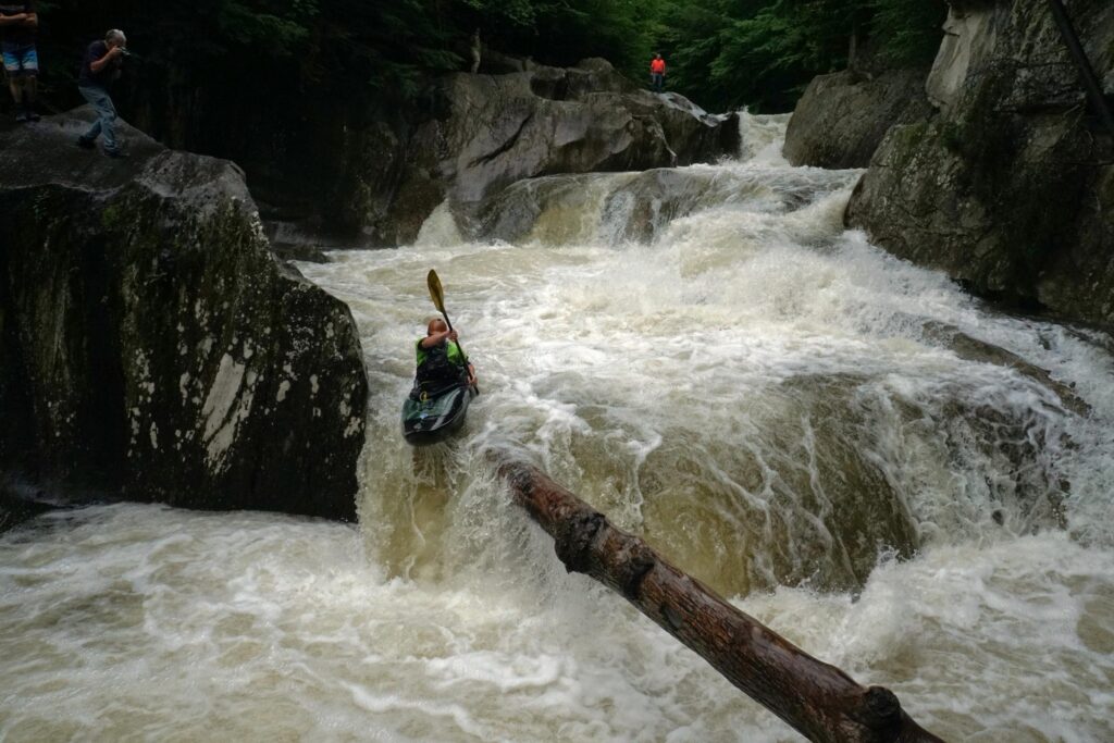 Justin Beckwith kayaks over the final ledge of Warren Falls on the Mad River Vermont whitewater kayaking