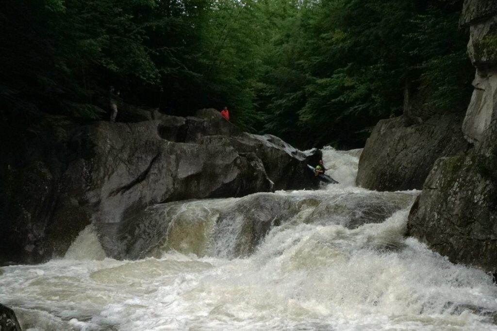 Justin Beckwith launches into Warren Fall on the Mad River Warren Vermont whitewater kayaking