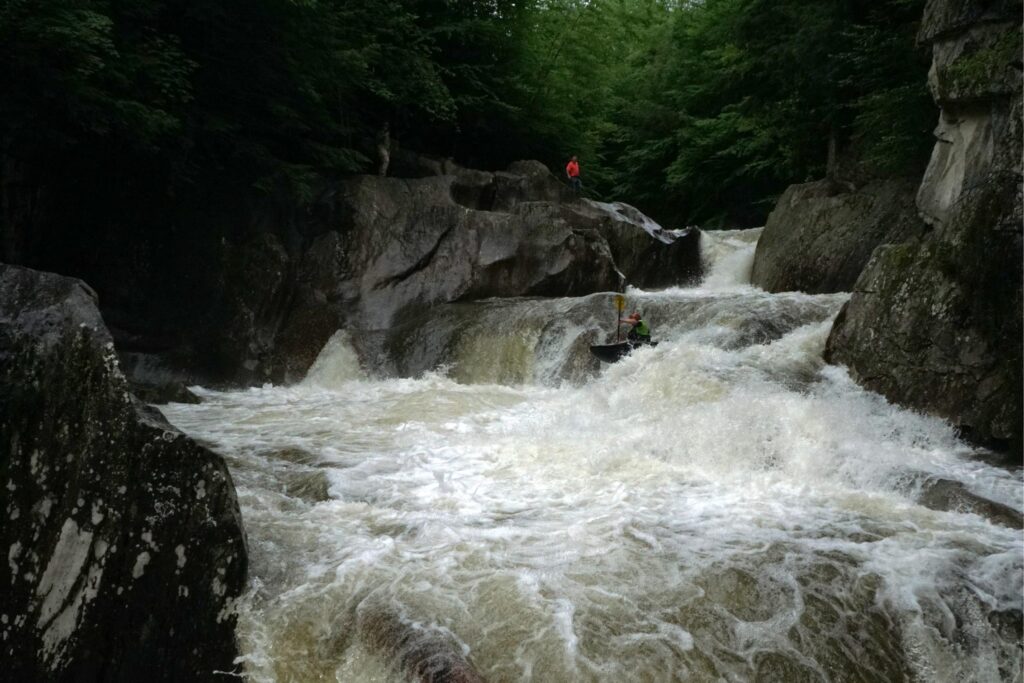 Justin Beckwith runs the middle ledge of Warren Falls on the Mad River Vermont whitewater kayaking