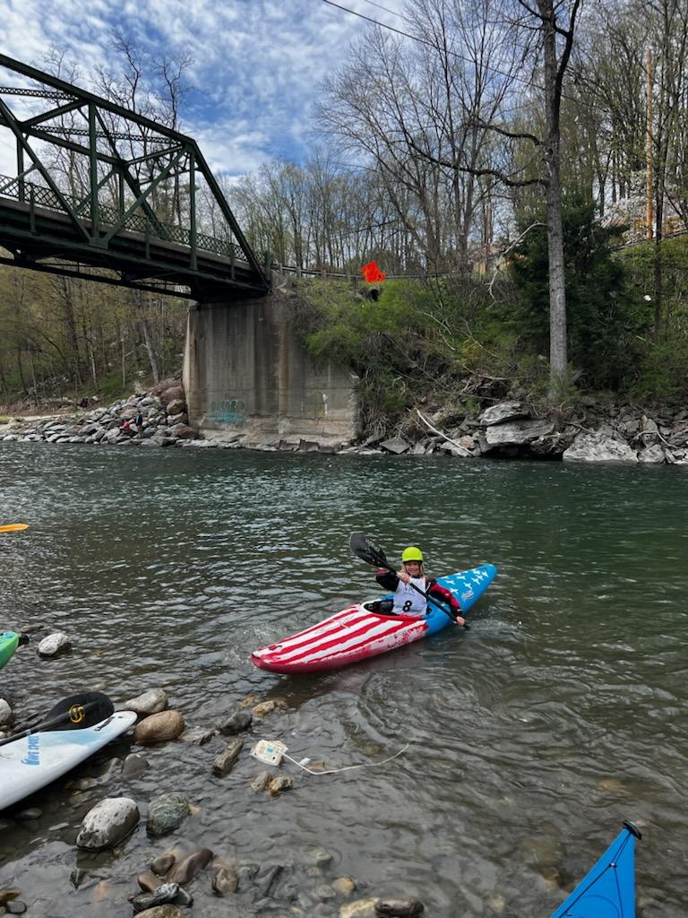 A kayaker after the finish line of the 2024 Peavine Race on the White River Vermont