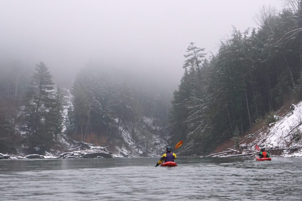 Two kayakers paddling on the White River near Stockbridge Vermont Whitewater Kayaking