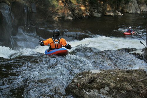 Erik Debbink paddles over a waterfall on the Wells River Vermont Whitewater Kayaking